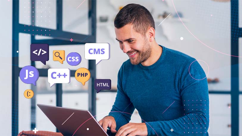 Smiling man using laptop with code icons – symbolizing long-term business growth via effective UI/UX implementation by EdroxCode in UAE, UK (London), Dubai, New York, and Canada.